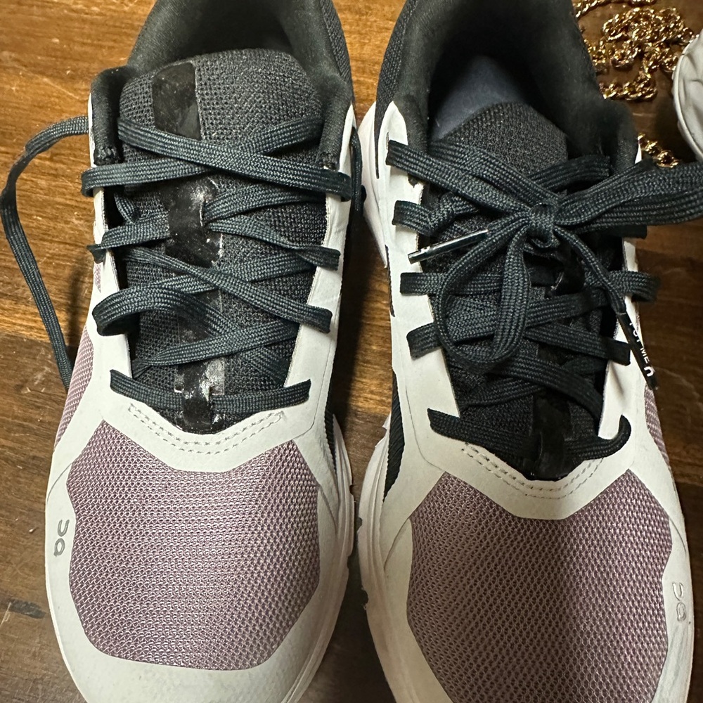 On Running Sneakers in purple, light gray, and Black